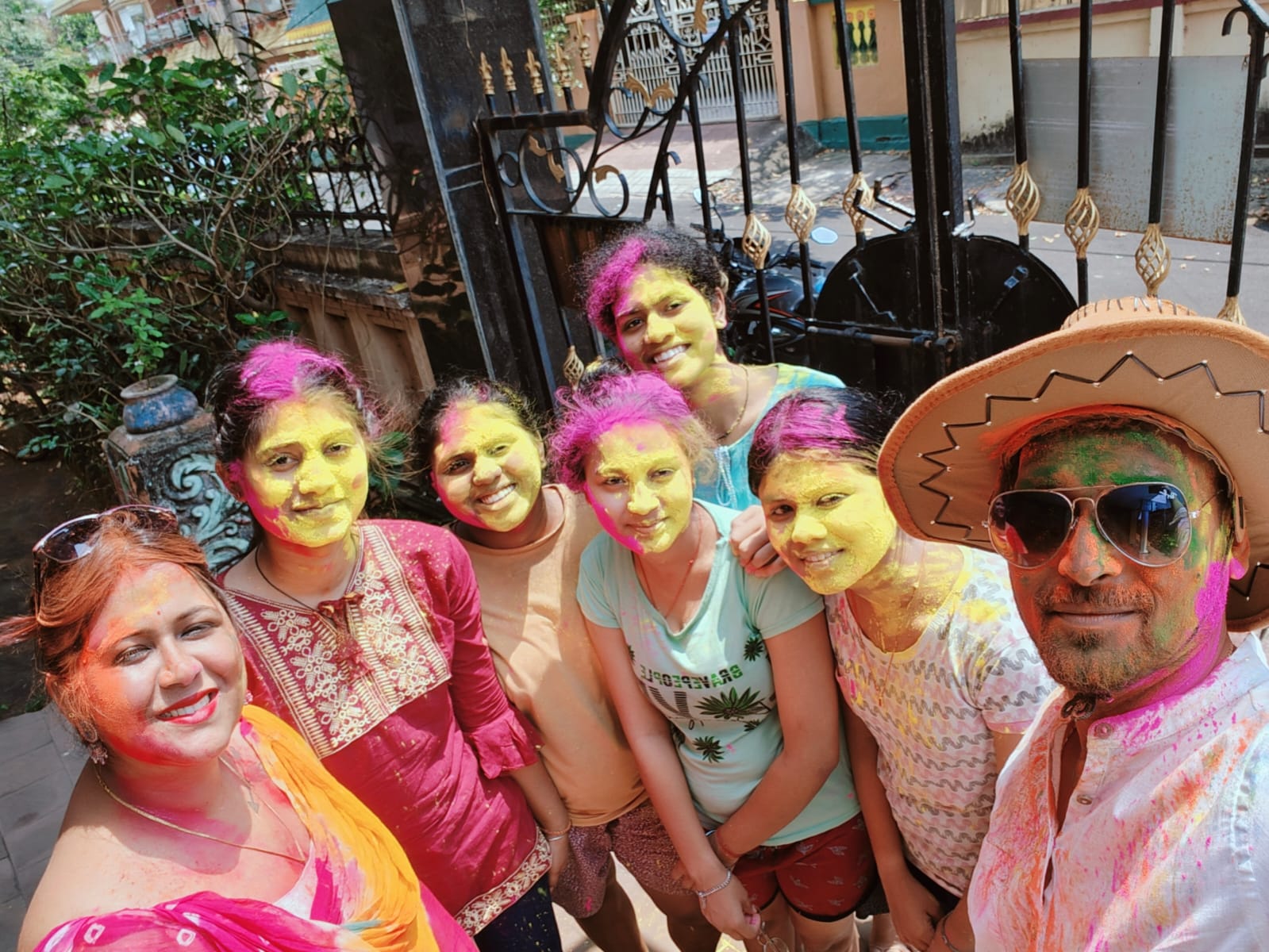 Students with Holi colours at campus gate